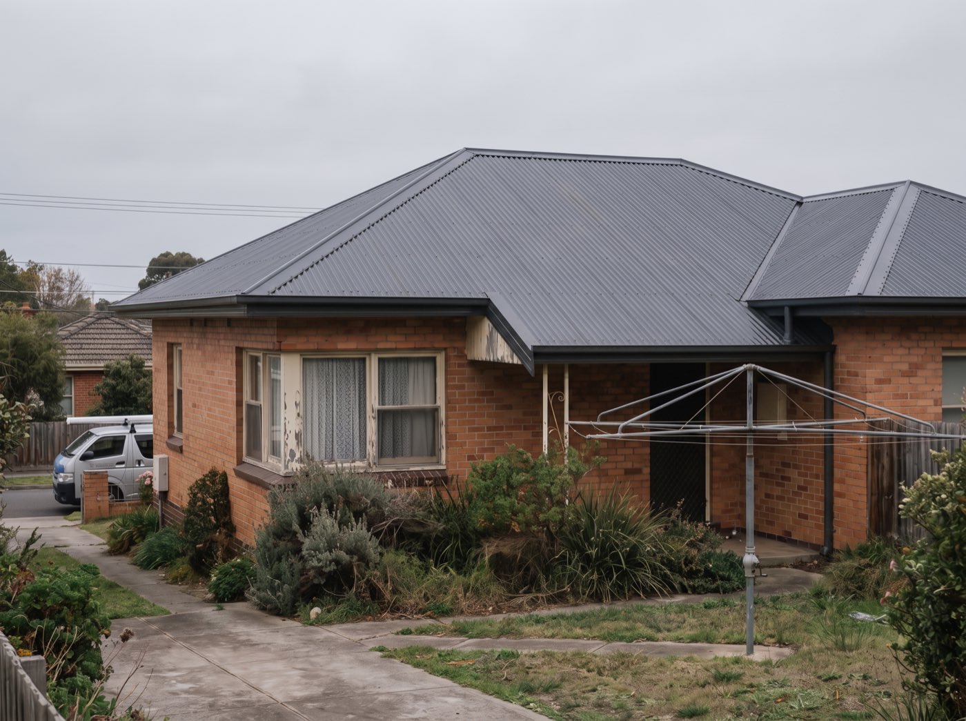 The same home with a new charcoal metal roof