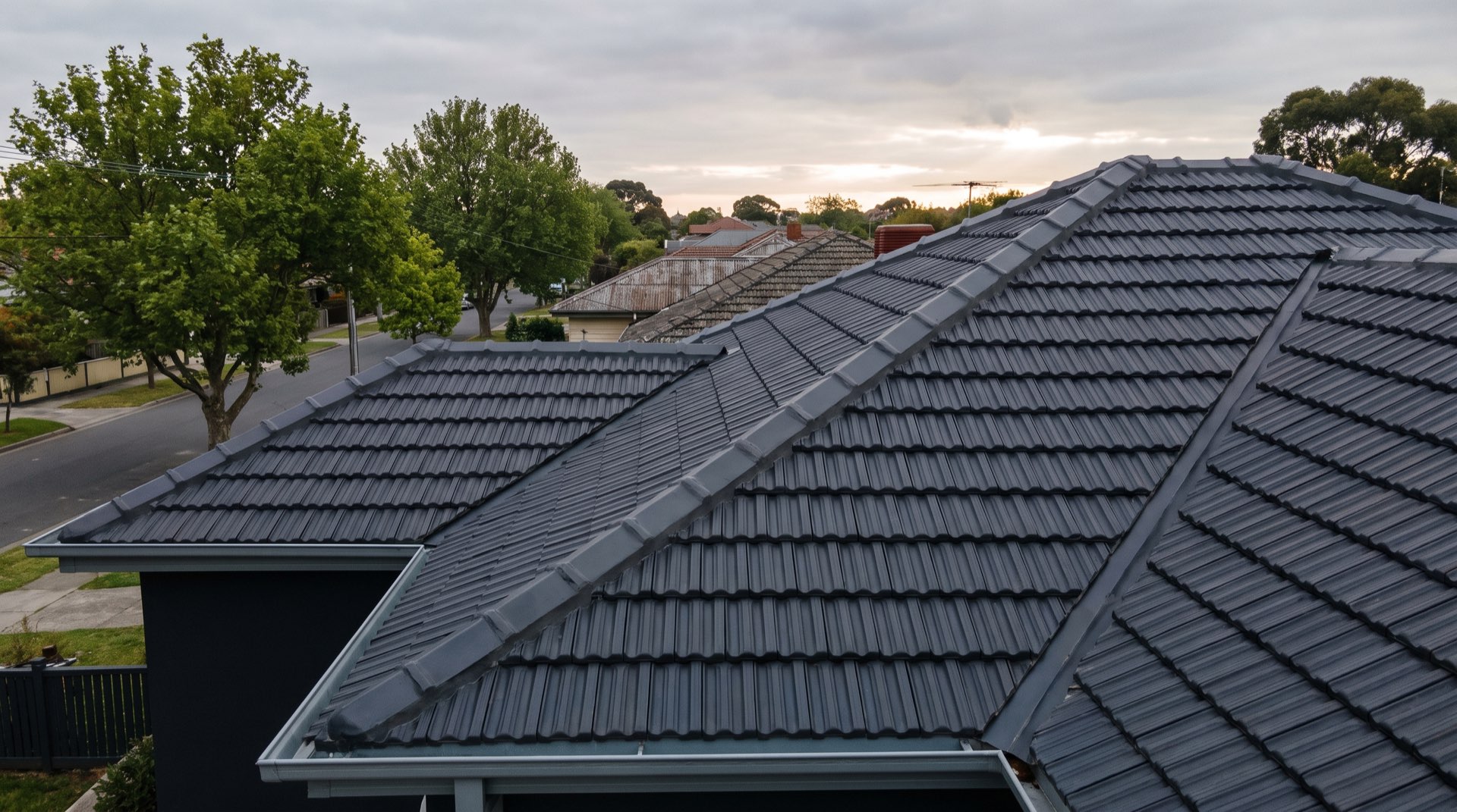 A freshly restored charcoal tile roof on a Melbourne home