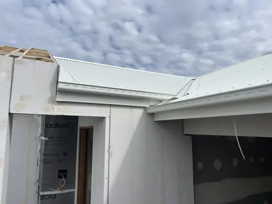 A new light metal roof on a home under construction