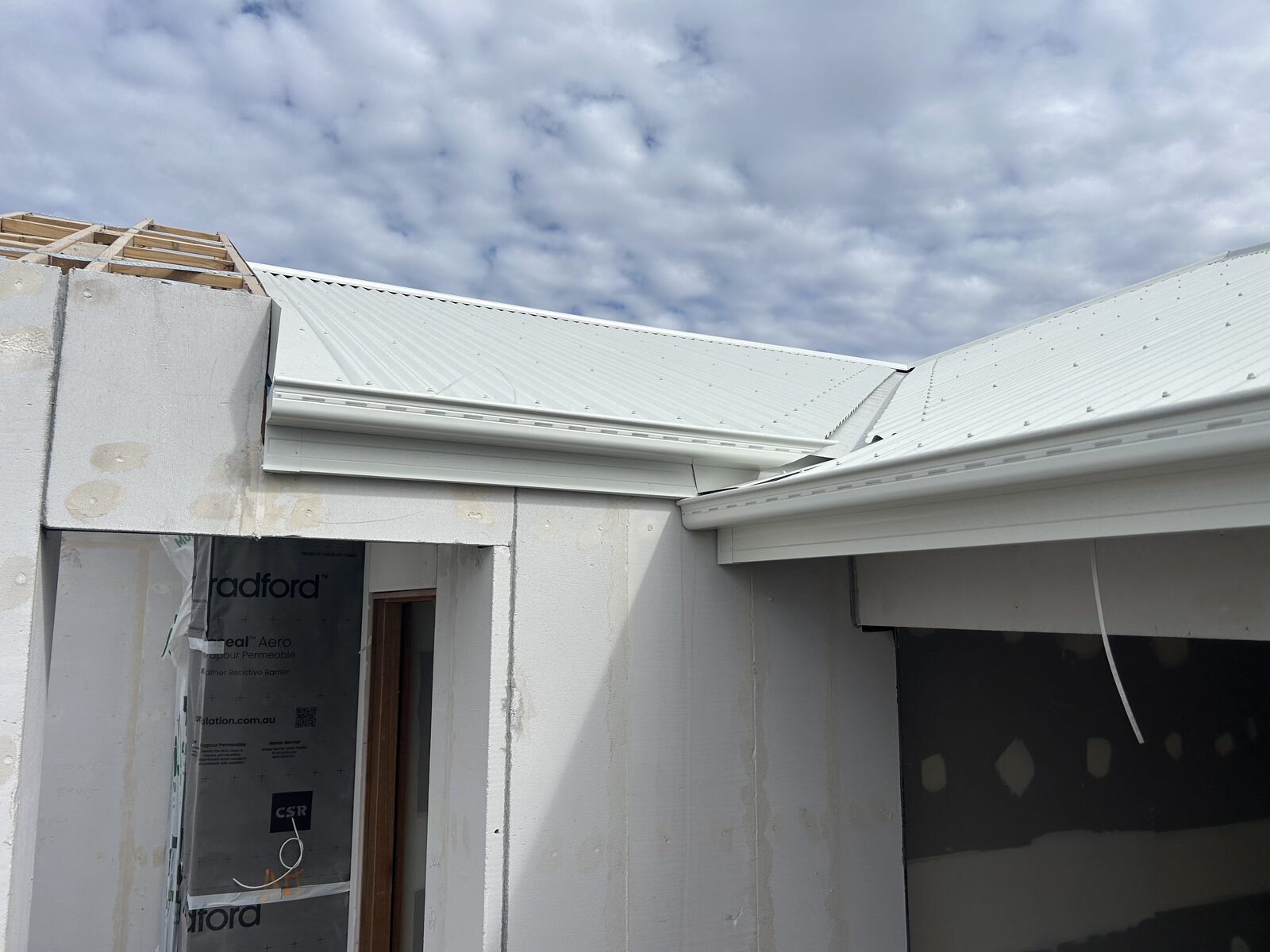 A new light metal roof on a home under construction